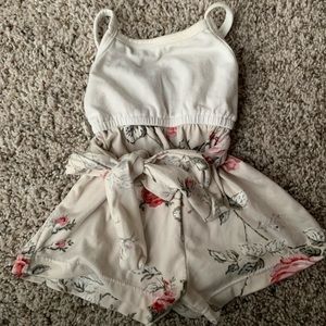 Baileys Blossoms Romper, never worn, comes from a smoke free/pet friendly home
